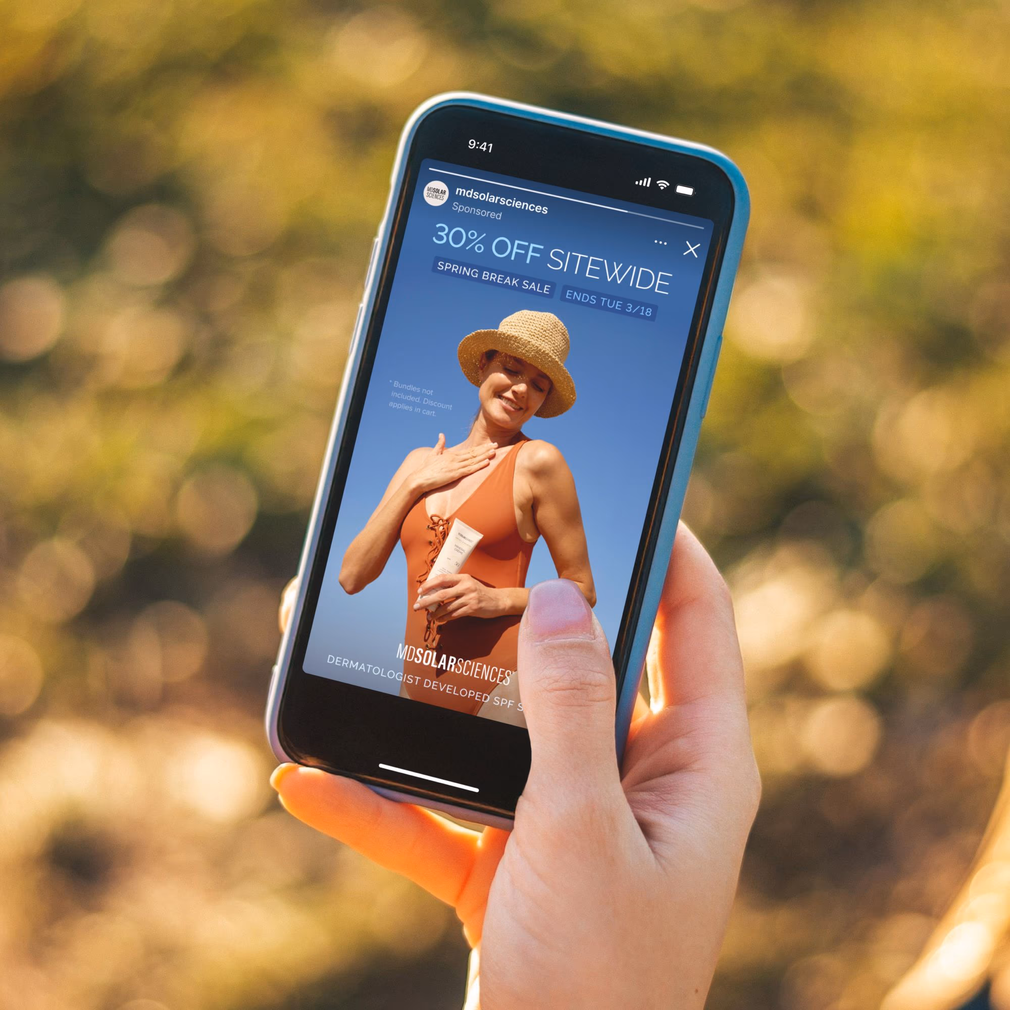 A smartphone depicting a well-designed ad for sunscreen.