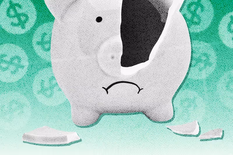 A broken piggy bank surrounded by dollar signs.